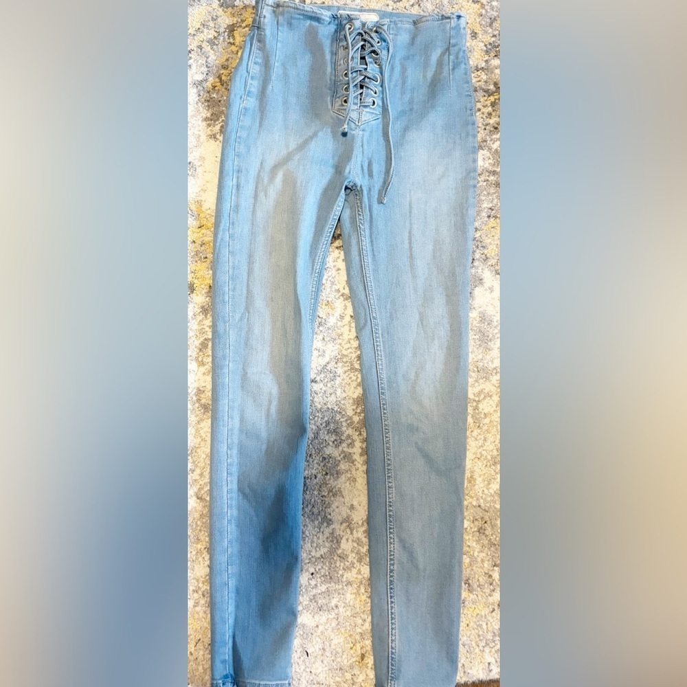 Free people woman lace up front light Blue Jeans size 25